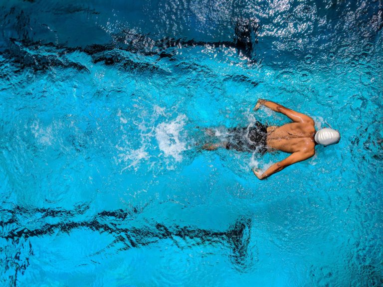 a person swimming in a pool