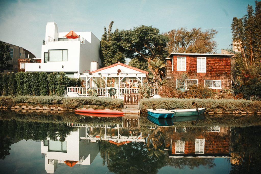 a body of water with boats and buildings along it