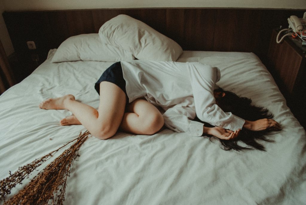 a baby lying on a bed