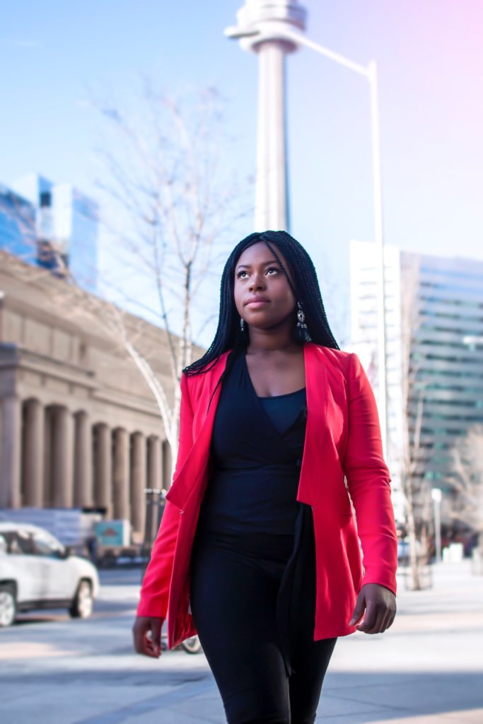 a woman in a red coat