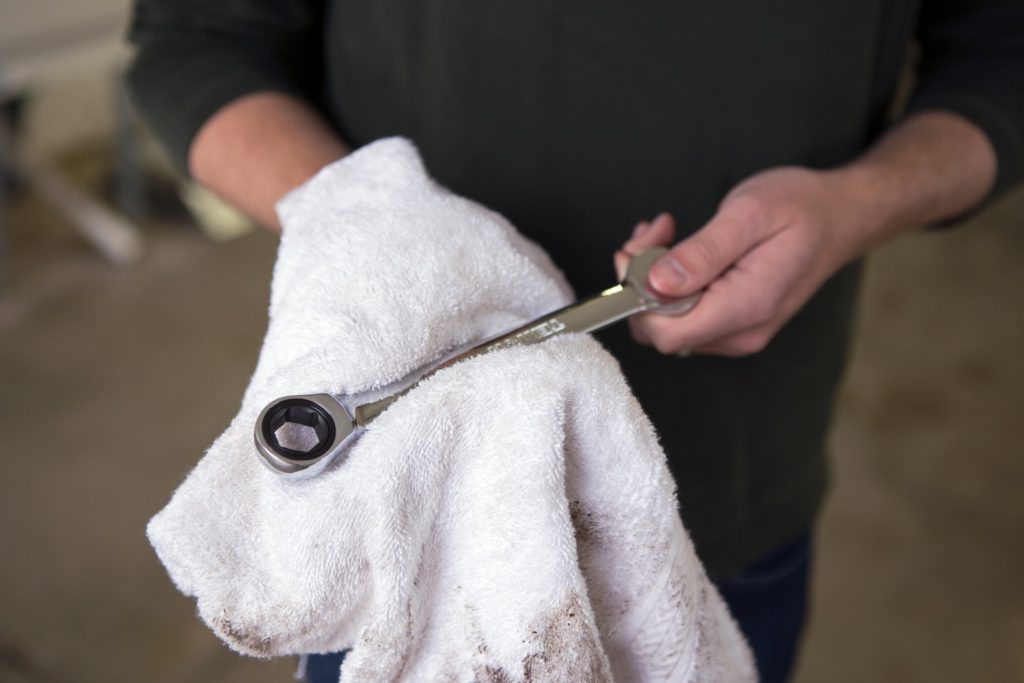 a person holding a white dog