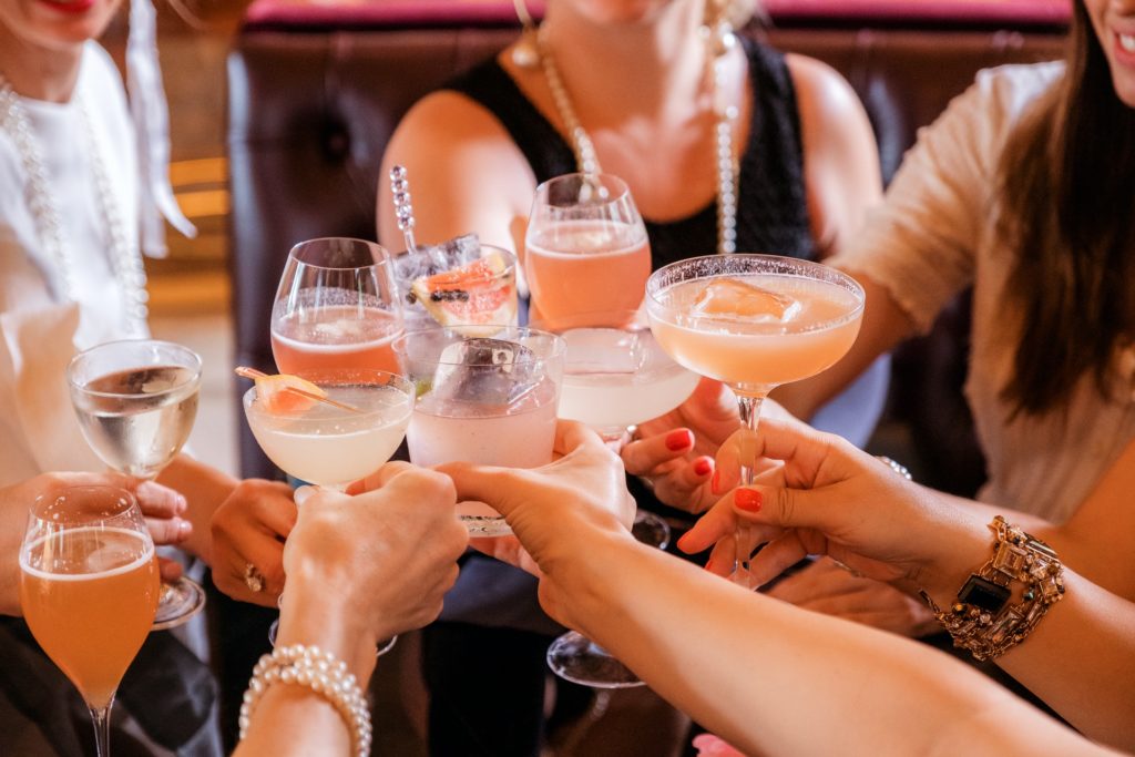 a group of people holding drinks