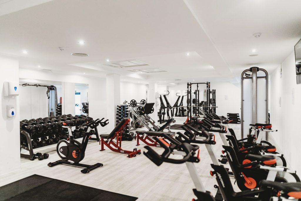 a room with many exercise equipment