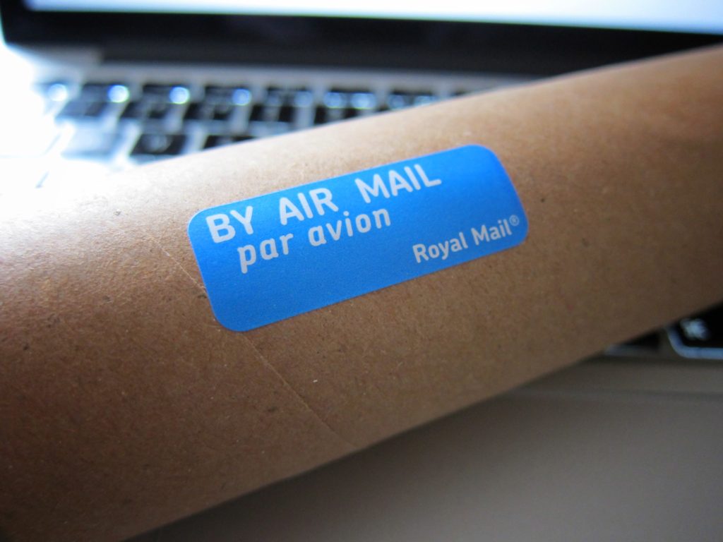 a box with a blue label on a desk