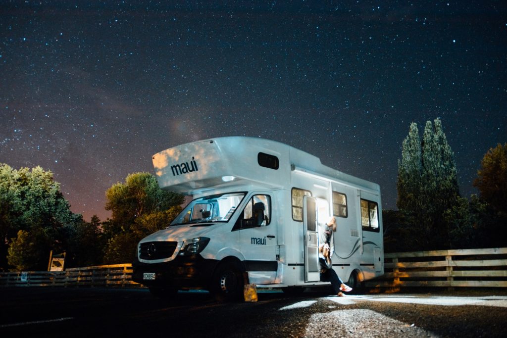 a white truck with lights on at night