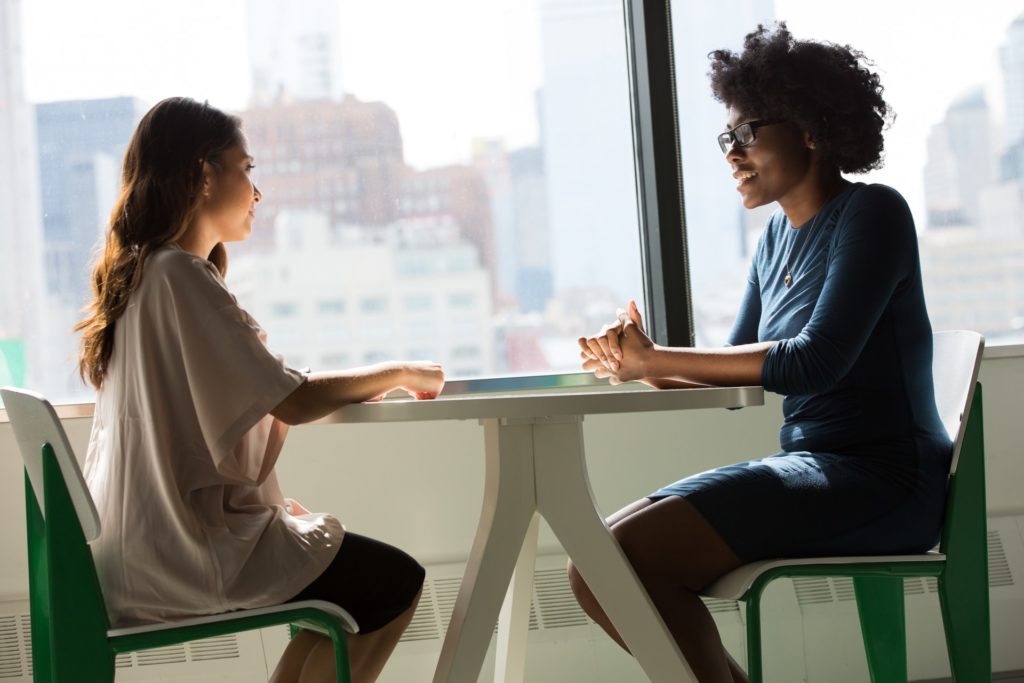 a woman and a man sitting at a table