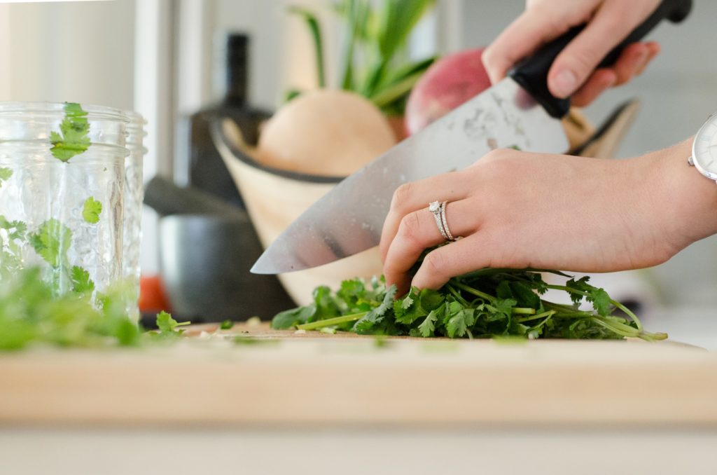 a person cutting vegetables