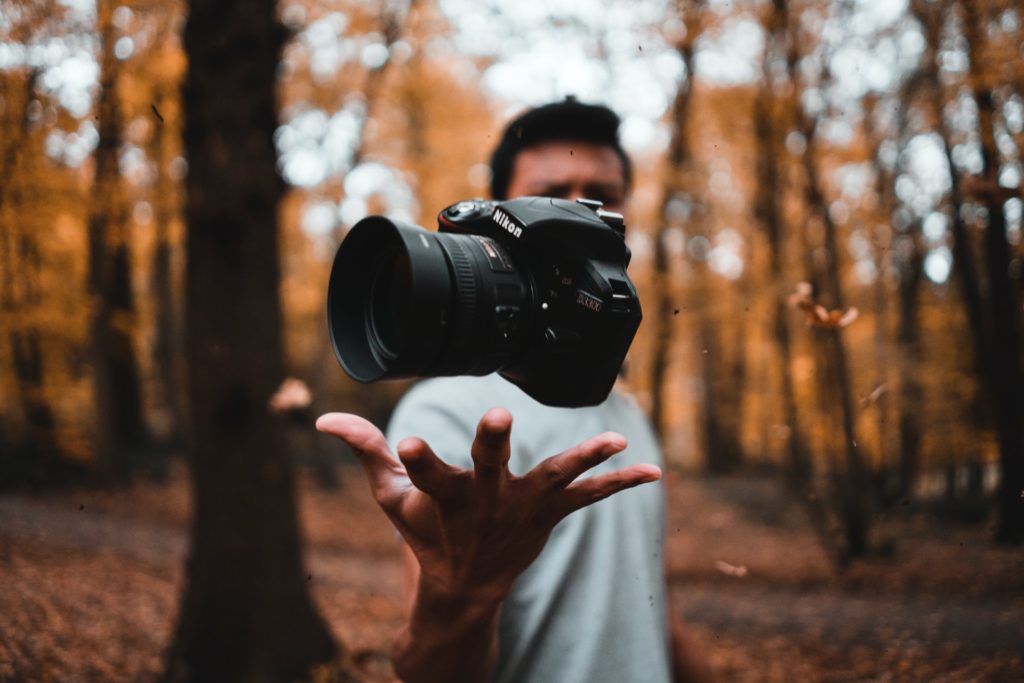 a man holding a camera